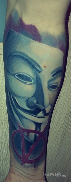 Tattoo V for Vendetta in characters motif on the forearm