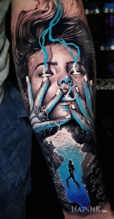 Tattoo Dzin? in 3D motif and realistic style on the forearm