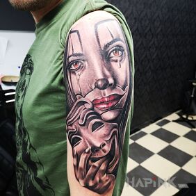 Tattoo Laughter through tears. on the upper arm motif: characters