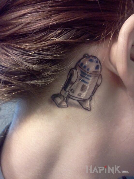Tattoo Robot in characters motif behind the ear