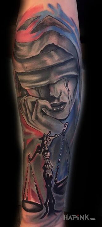 Tattoo Temida in colorful motif on the forearm