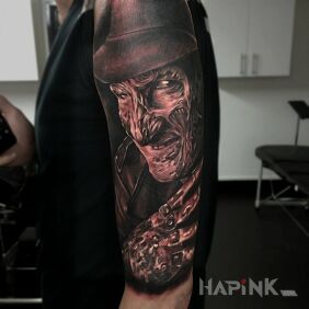 Tattoo Freddie Kruger on the upper arm motif: characters