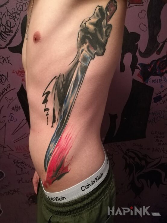 Tattoo Wakizashi seppuku in colorful motif and japanese / irezumi style on the ribs