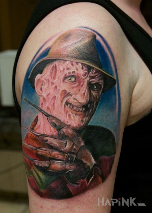 Tattoo Freddie Kruger 2 in characters motif on the upper arm
