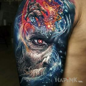 Tattoo Cosmically on the upper arm motif: colorful