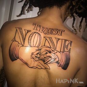 Tattoo With the message on the back motif: lettering