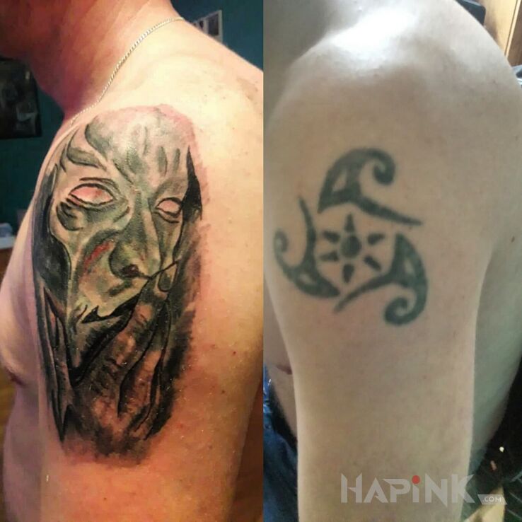 Tattoo Maska in faces motif on the upper arm