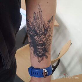 Tattoo Wolf on the forearm motif: animals