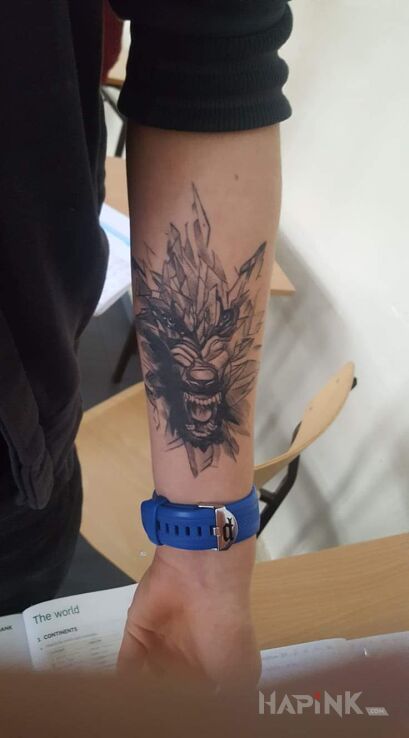 Tattoo Wolf in animals motif on the forearm