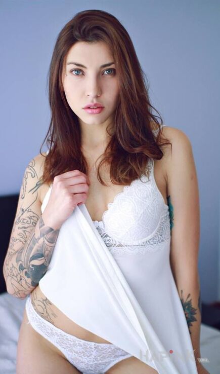 Tattoo Aniolek in sexy motif on the forearm