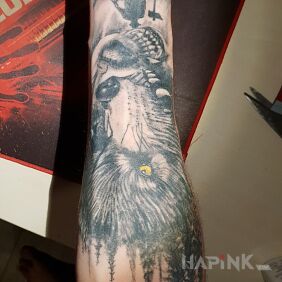 Tattoo Wolves and the forest on the forearm motif: animals