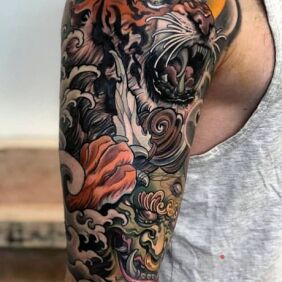 Tattoo Cos in Japanese on the upper arm motif: animals style: japanese / irezumi