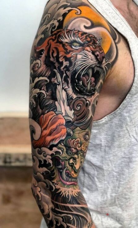 Tattoo Cos po japonsku in sleeves motif and japanese / irezumi style on the forearm