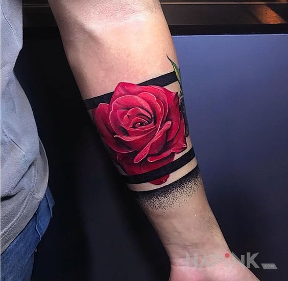 Tattoo Róża, czerwona róża in colorful motif and realistic style on the forearm