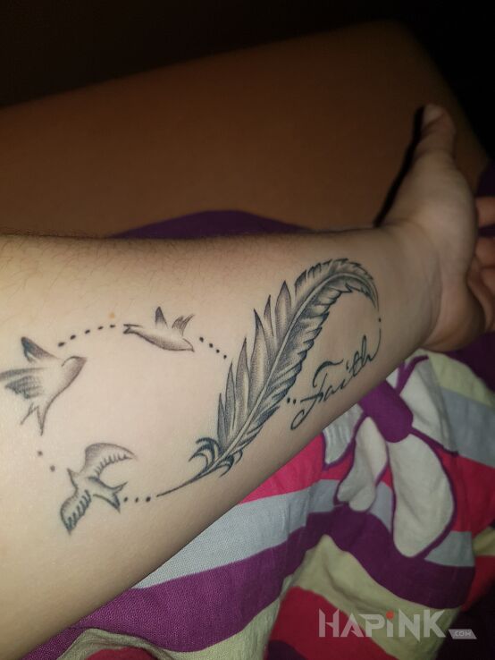 Tattoo Nieskończoność in lettering motif on the forearm