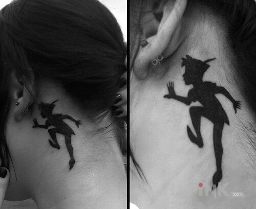 Tattoo Piotruś Pan in characters motif behind the ear