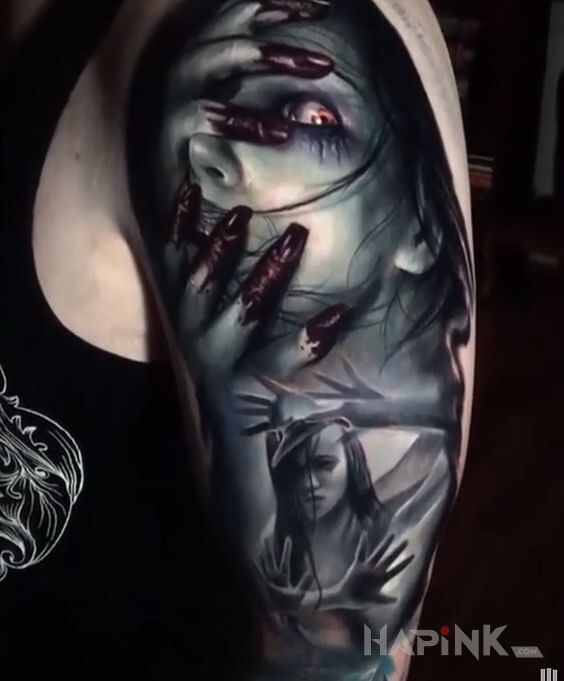Tattoo Horrorowo in faces motif and realistic style on the upper arm
