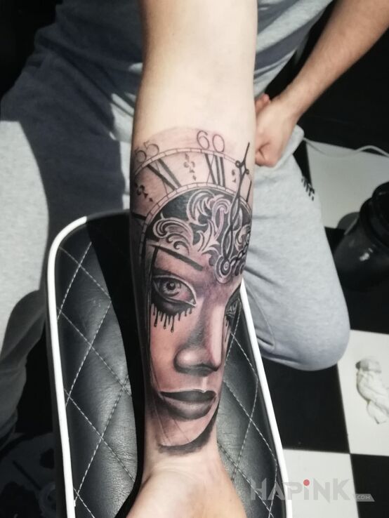 Tattoo Ładny in black and gray motif and realistic style on the forearm