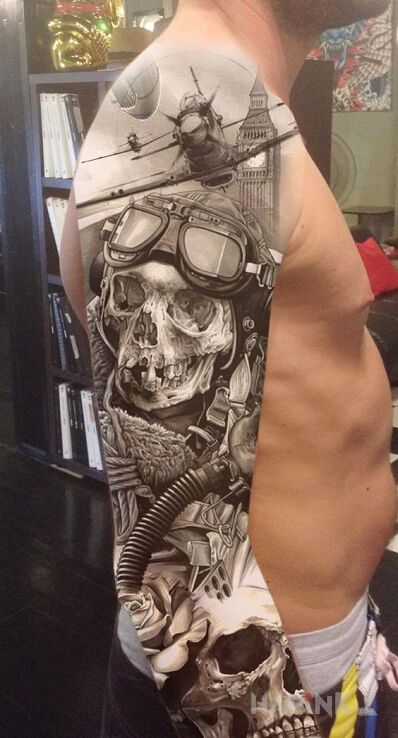 Tattoo Wojenka na rękach in black and gray motif and realistic style on the upper arm