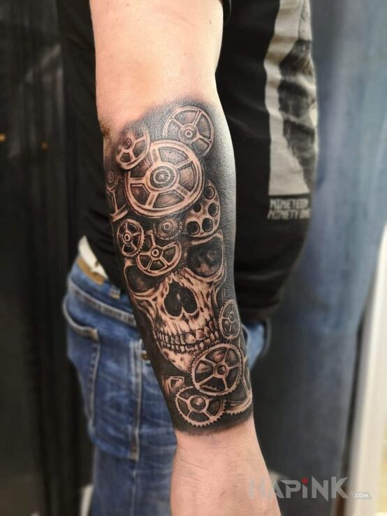 Tattoo Czacha in black and gray motif and realistic style on the forearm