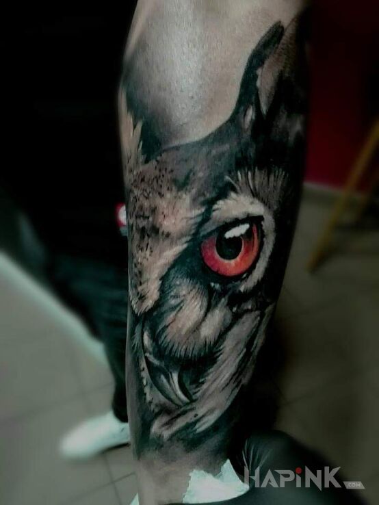 Tattoo Sowa? in animals motif and realistic style on the calf