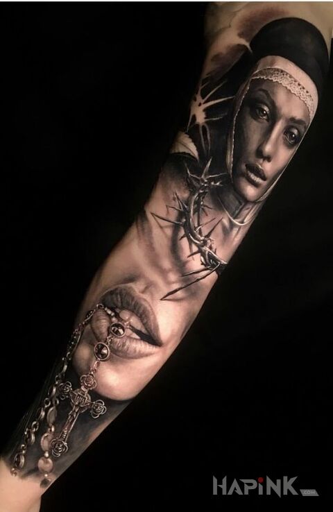 Tattoo Zakonnica in religious motif and realistic style on the upper arm