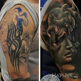 Tattoo No trace of tribal on the upper arm motif: faces style: realistic