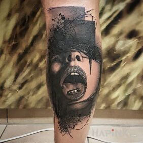 Tattoo Cartridge on the calf motif: black and gray style: realistic