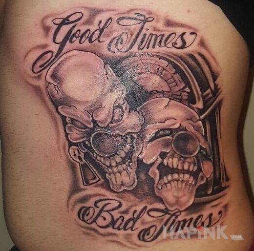 Tattoo Good Times Bad Times in lettering motif and calligraphy style on the ribs