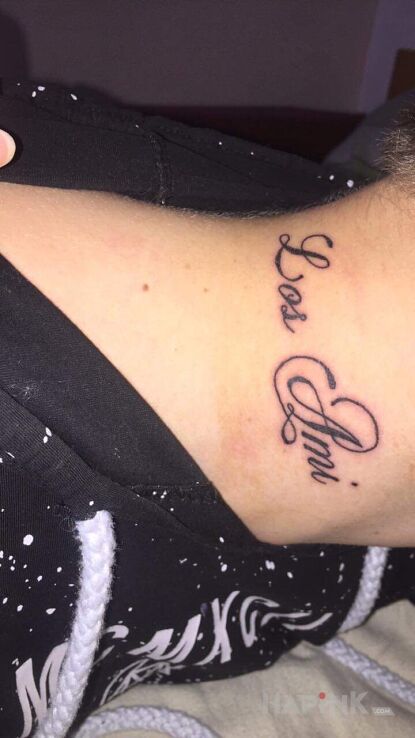 Tattoo Los Ami in lettering motif and calligraphy style on the neck