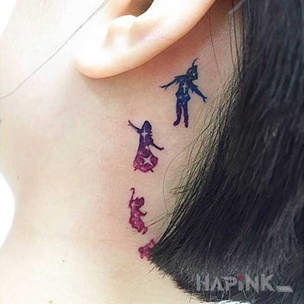 Tattoo Piotruś Pan in characters motif and graphic / illustrative style behind the ear