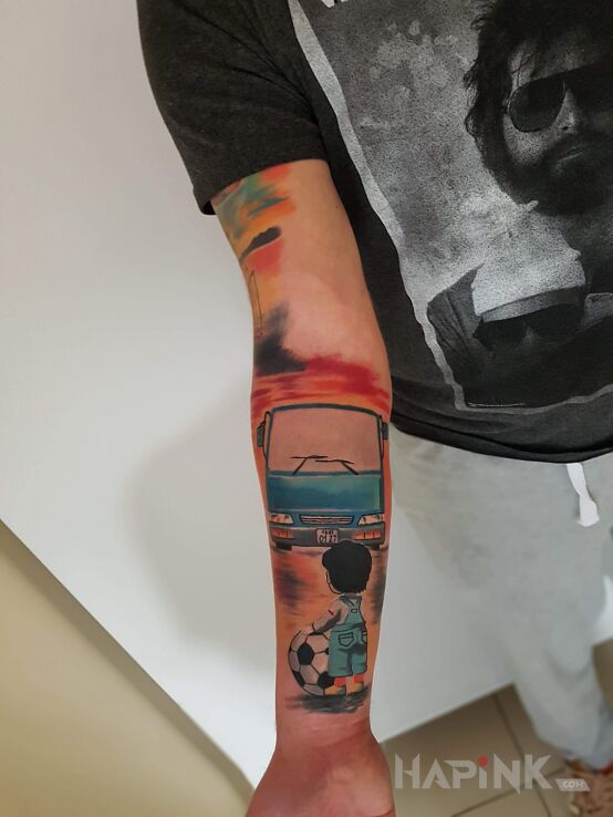Tattoo Pasja od dzieciństwa.. in colorful motif and cartoon / comic book style on the forearm