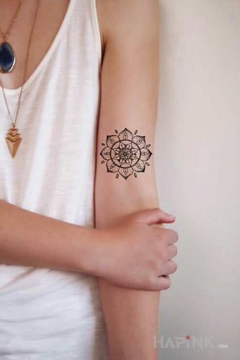Tattoo Mandala in mandalas motif and graphic / illustrative style on the upper arm