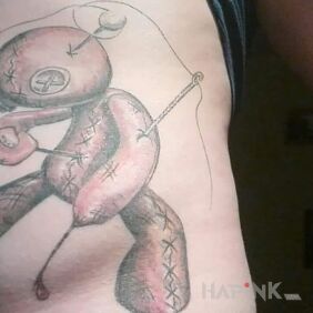 Tattoo Woodoo doll on the ribs motif: characters style: graphic / illustrative