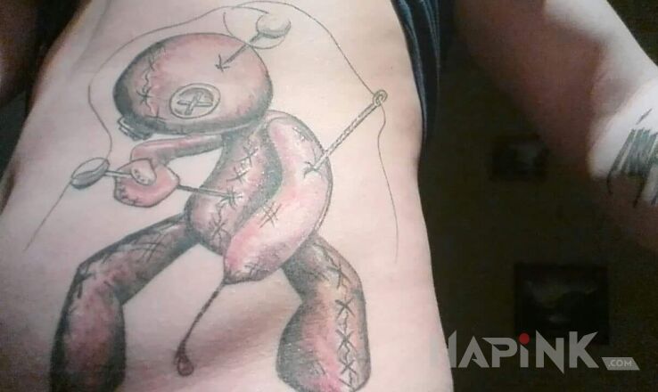 Tattoo Laleczka woodoo in characters motif and graphic / illustrative style on the ribs