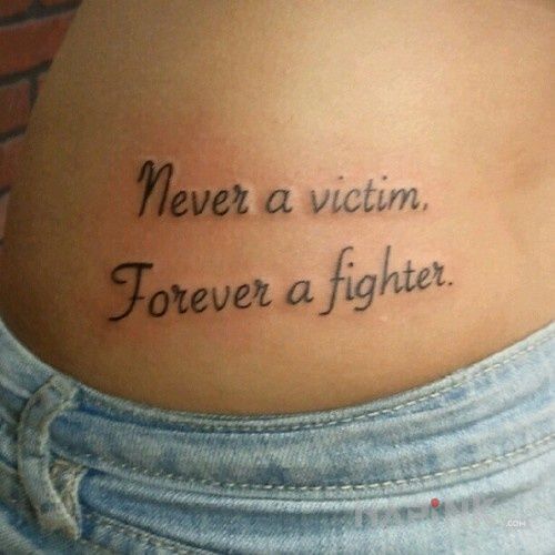 Tattoo Zawsze jako wojownik in lettering motif and calligraphy style on the stomach
