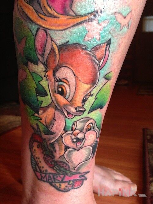 Tattoo Bambi in characters motif on the leg
