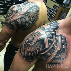 Tattoo Biotic arm on the shoulder blades motif: black and gray style: biomechanics