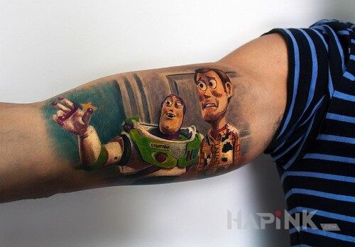 Tattoo Buzz Astral i Chudy  in characters motif on the upper arm