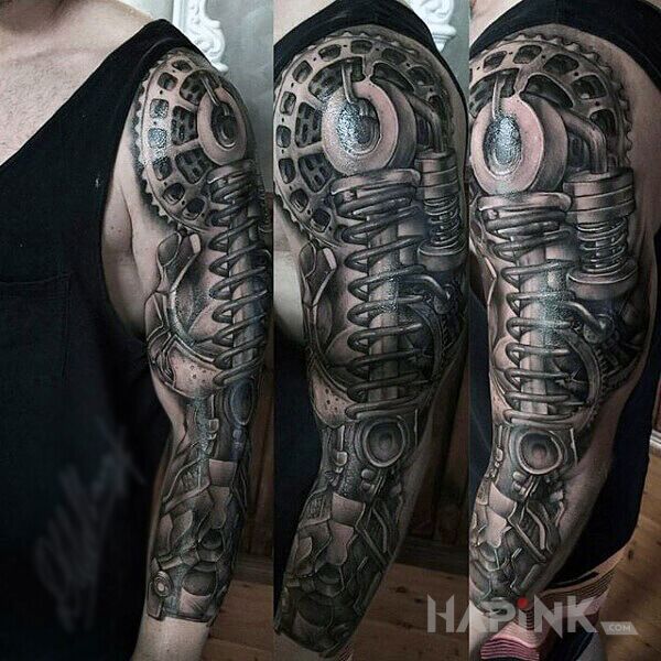 Tattoo Resory w łapie in black and gray motif and biomechanics style on the upper arm