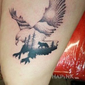 Tattoo Orzeł i las in animals motif and graphic / illustrative style on the leg
