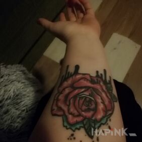 Tattoo Rose on the forearm motif: colorful style: graphic / illustrative