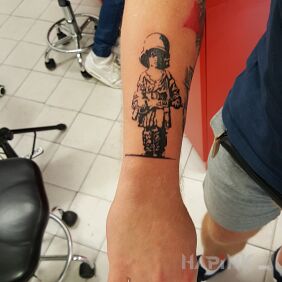 Tattoo Little insurgent on the forearm motif: characters style: graphic / illustrative