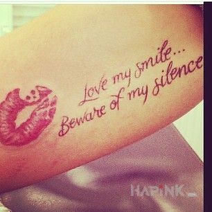 Tattoo Całusek in lettering motif and calligraphy style on the forearm