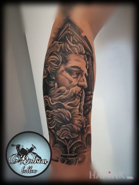 Tattoo Posejdon in faces motif and graphic / illustrative style on the forearm