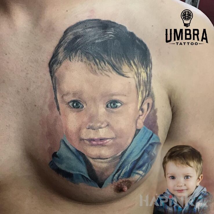 Tattoo Portret in faces motif and realistic style on the chest