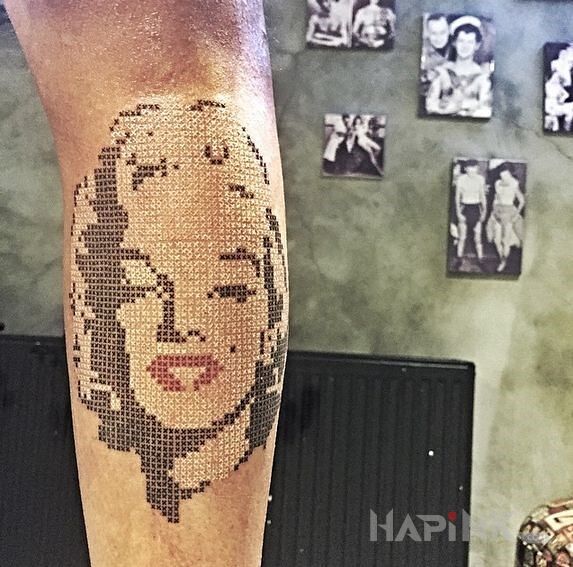Tattoo Marilyn Monroe in faces motif on the forearm