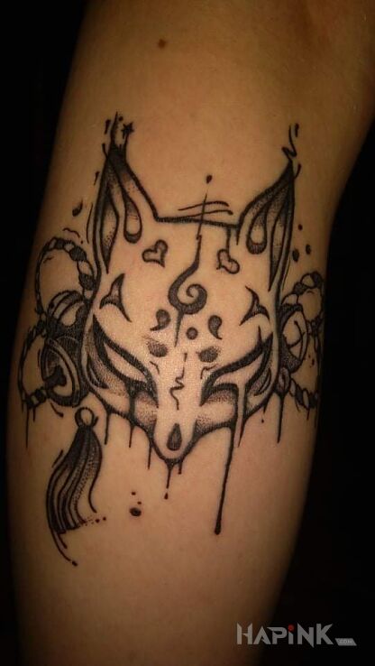Tattoo Kitsune in demons motif and graphic / illustrative style on the calf