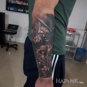 Tattoo Insurgent on the forearm motif: black and gray style: realistic