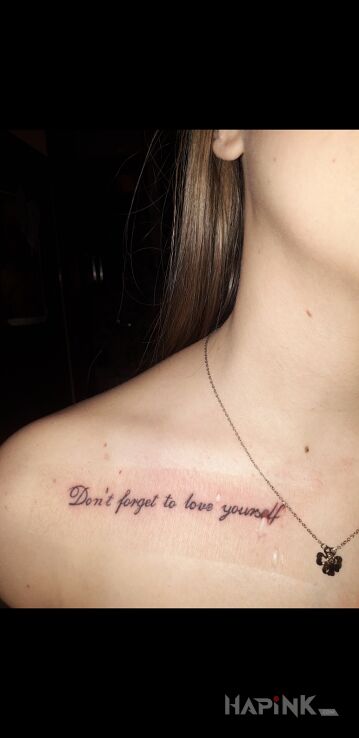 Tattoo Don't in lettering motif and calligraphy style on the collarbone